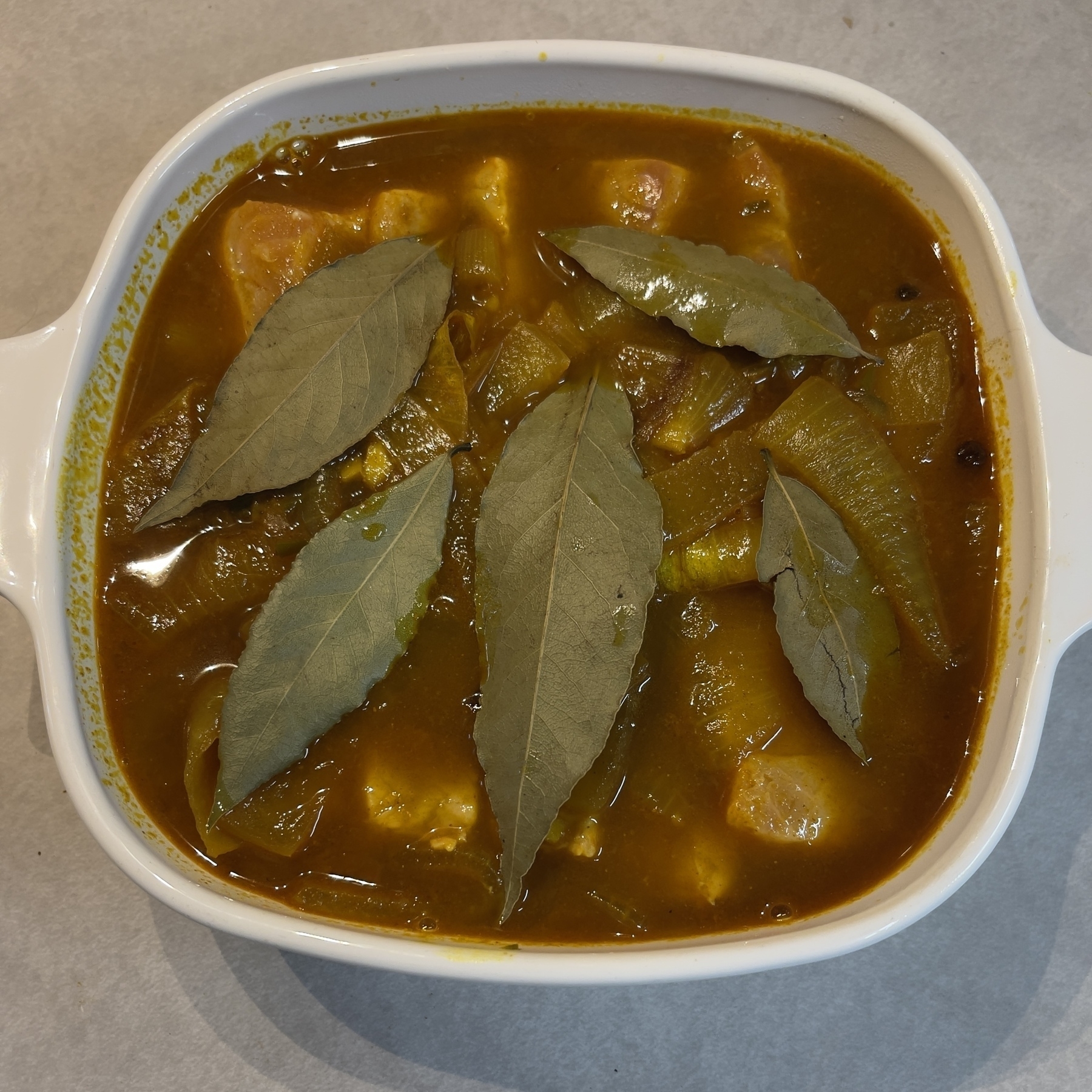 Cape Malay pickled fish ready for refrigerator.