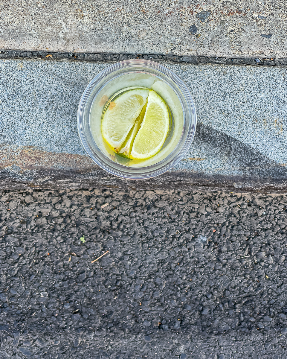 Cocktail In Plastic Cup on the Curb