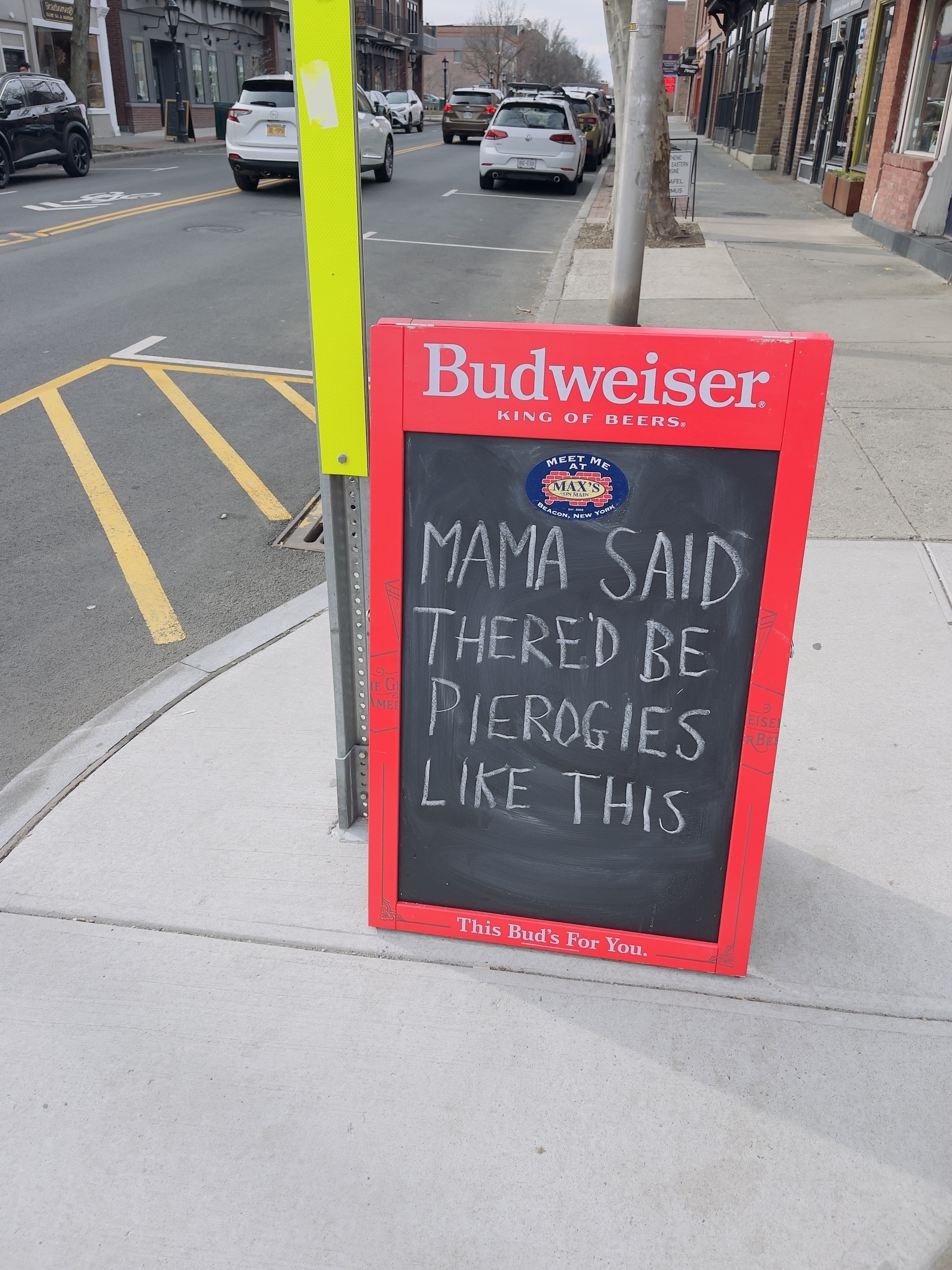 Sandwich board in front of a restaurant saying “mama said there’d be days like this”