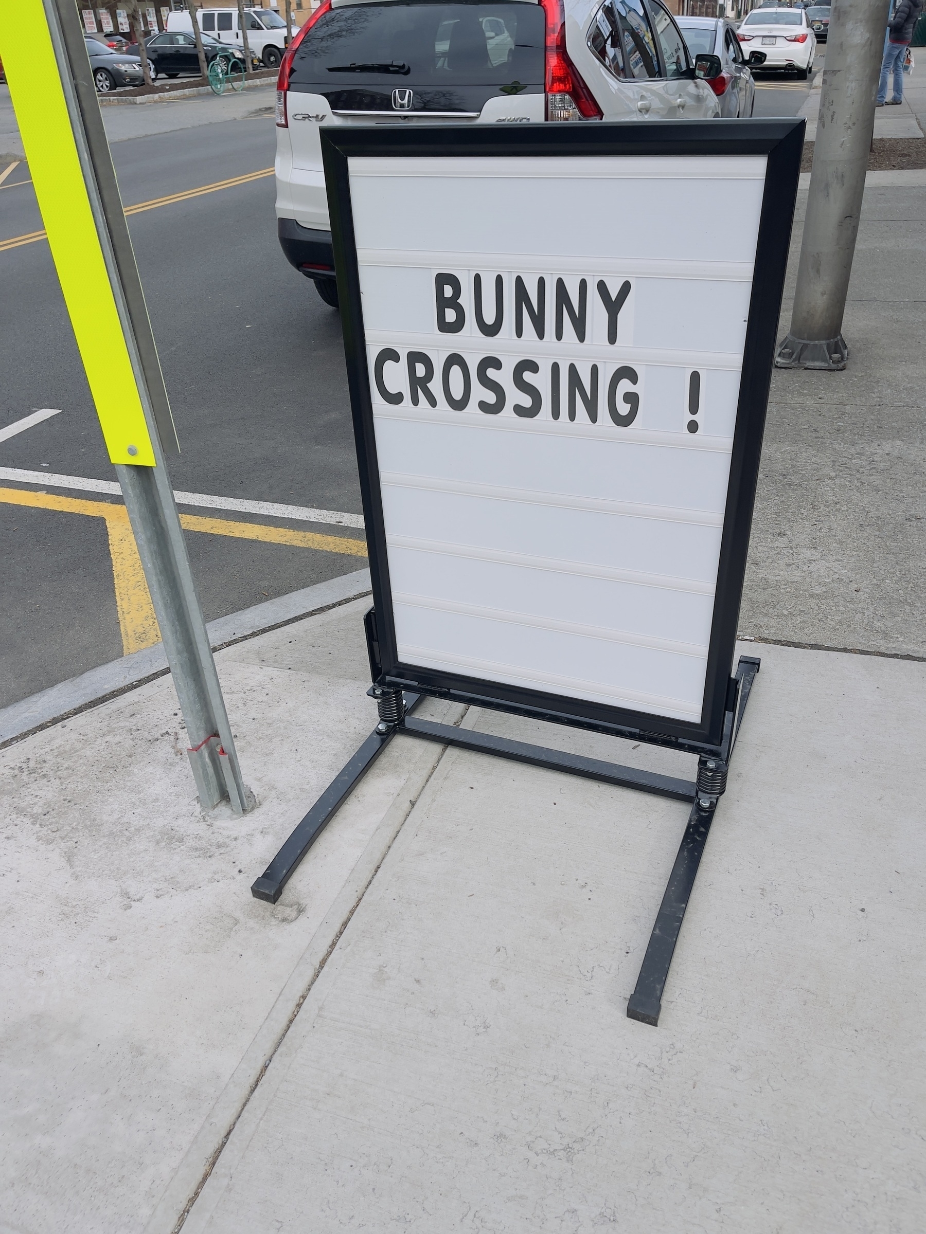 Sign outside local chocolate shop at easter time saying “Bunny Crossing”