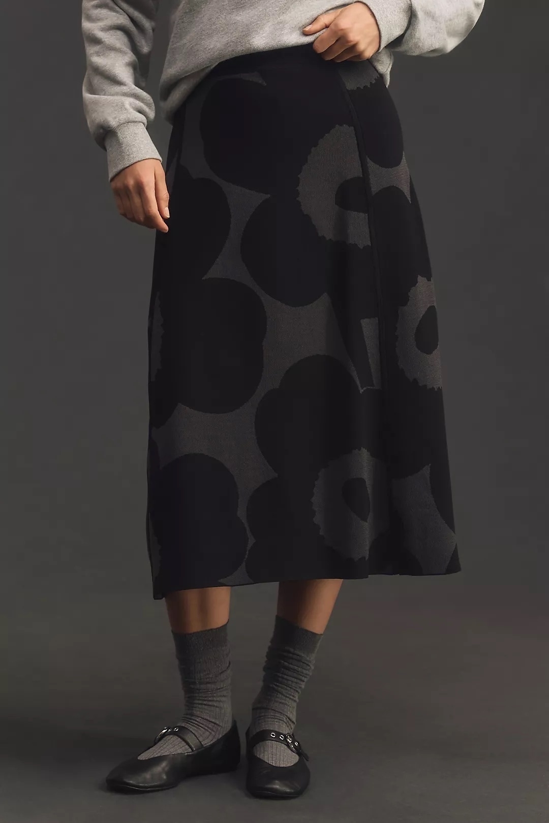 Black and gray Marimekko A line skirt on a model. 